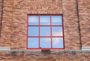 Brick building against blue sky, symbolizing stability and architectural legacy