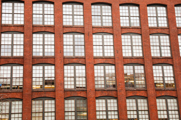 Brick building against blue sky, symbolizing stability and architectural legacy