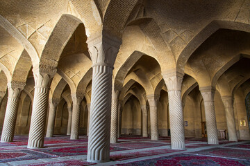 Magnificent brick arches and limestone pillars of Vakeel  mosque in Shiraz, Iran.