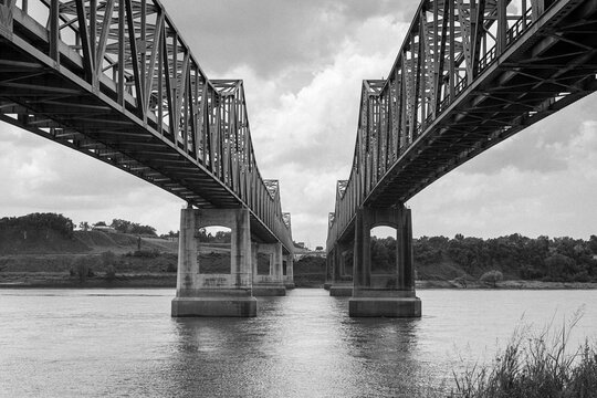 Grainy archival black and white view of the Natchez Mississippi river bridges.  Photo taken in May 1996.