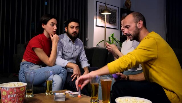 Moments when four friends gather at home, play games together, and have fun