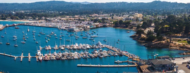 Poster Im Rahmen Beautiful aerial view of the Monterey town in California with many yachts docked by the pier. © ingusk