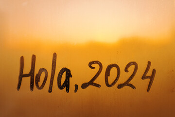 lettering Hola in Spanish is hello in english and numbers 2024 paint with finger with streaks of...