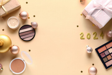 Christmas composition with different makeup products and gift boxes on beige background
