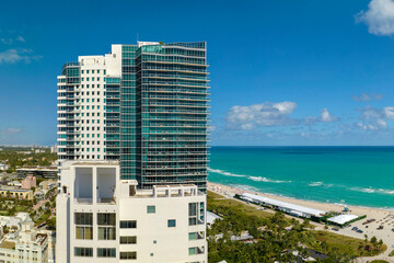 Popular vacation spot in the United States. Ocean warm waters and sandy beachfront at Miami Beach...