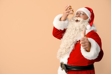 Fototapeta na wymiar Santa Claus eating tasty pizza and showing thumb-up on beige background