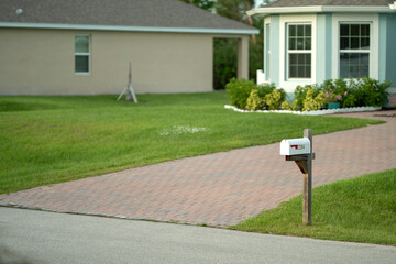 Typical american outdoors mail box on suburban street side