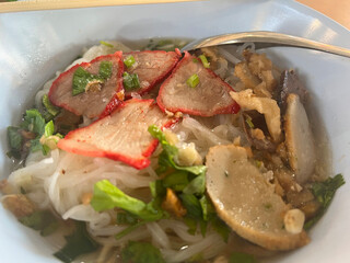 close up view of delicious asian cuisine, red pork noodle