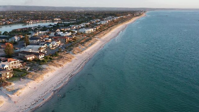 Aerial of Tennyson Beach and suburbs at sunset in Adelaide, South Australia