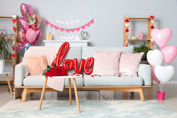 Interior of festive living room with grey sofa and decor for Valentine's Day celebration
