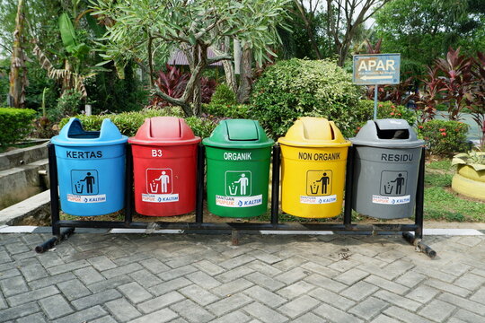 PKT or Pupuk Kalimantan Timur Company logo which provides different colored trash bins according to the type of waste. Bontang, East Kalimantan, Indonesia. December 20 2023