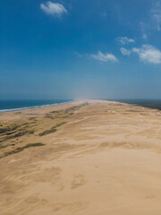 Fototapeta na wymiar Aerial view of sand dune with sunny sky.