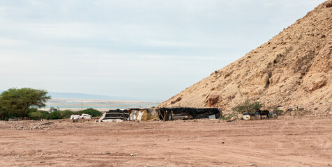 The home of a Bedouin family is located at the foot of a mountain near Wadi Numeira gorge in Jordan