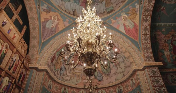 Chandelier Inside The Orthodox Church With Painted Ceiling And Walls. - low angle shot