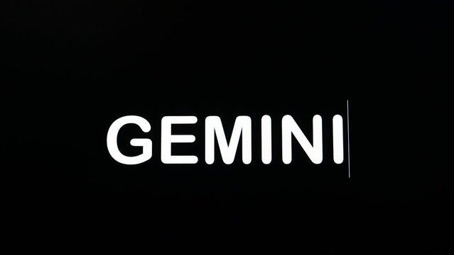 Typing on screen with black background written Gemini