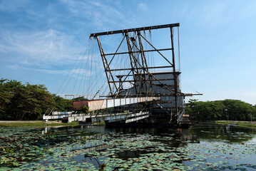 The last abandoned tin mining dredger during British colonial now display in Tanjung Tualang, Batu Gajah, Perak, Malaysia - obrazy, fototapety, plakaty