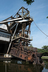 Fototapeta na wymiar The last abandoned tin mining dredger during British colonial now display in Tanjung Tualang, Batu Gajah, Perak, Malaysia