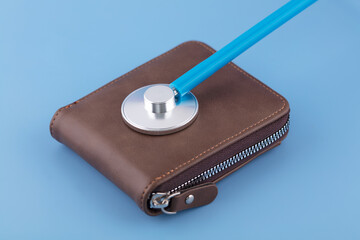 The stethoscope is diagnosing a wallet
