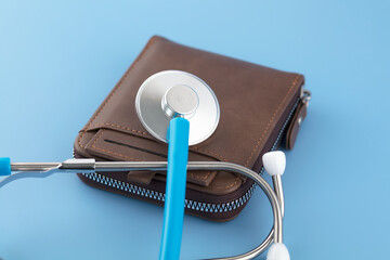 The stethoscope is diagnosing a wallet