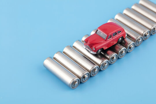 The car is driving on the road of dry batteries