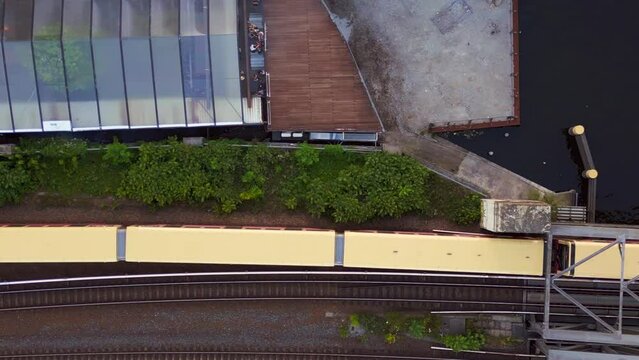s bahn Techno Party electro dance club disco city Berlin Germany summer day. Nice aerial top view flight 
4k cinematic footage
