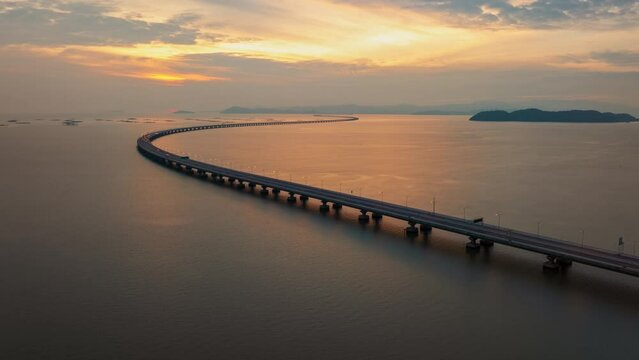 Hyperlapse timelapse aerial drone view flying to Penang bridge at sunset, Malaysia
