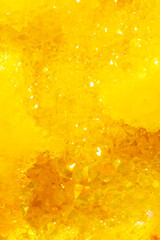 Golden crystal mineral stone. Gems. Mineral crystals in the natural environment. Texture of...