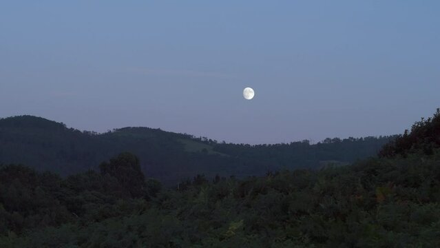 View of Moon Over Mountains in Spain, Asturias. Moonrise at Dusk