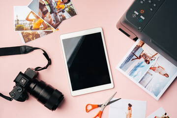 Printer, photo camera and digital tablet on table. Printing photos concept