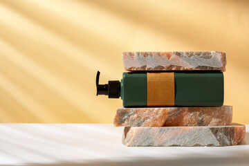 Cosmetic package dispenser with granite stone studio shot