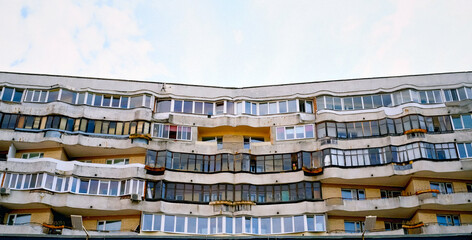 Aged facade of apartment building, soviet architecture. Front view close up