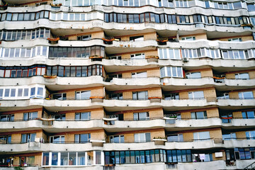 Aged facade of apartment building, soviet architecture. Front view close up