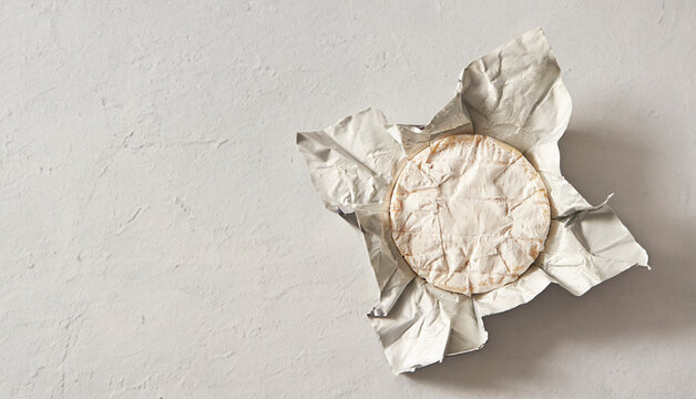 Packaged camembert cheese, fresh cheese