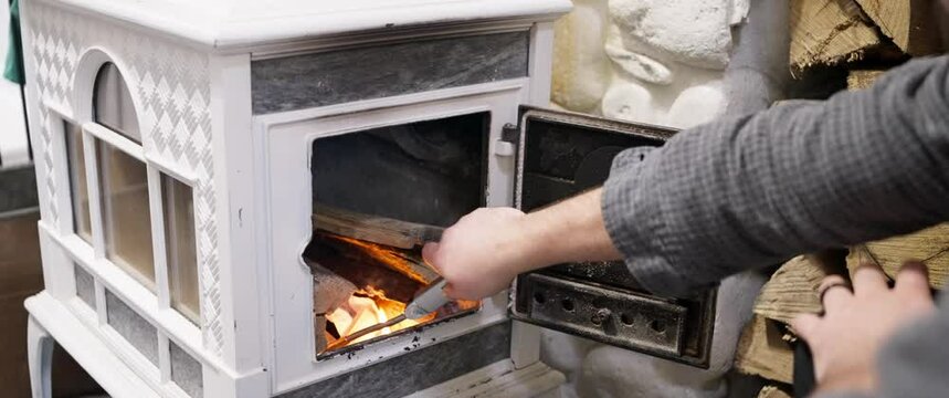 Building a fire in a wood stove
