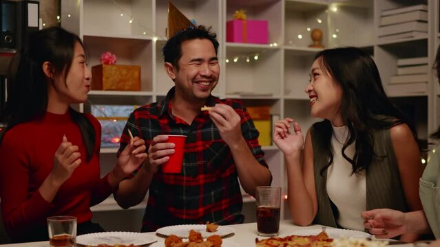 Friends join and celebrate the party with eating foods and drinks. Happy and joyful in holiday weekend and festival.