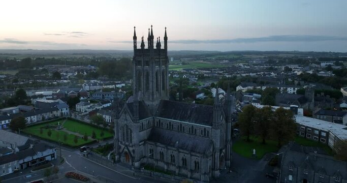 Gothic cathedral against the backdrop of a city with one storey houses 4k