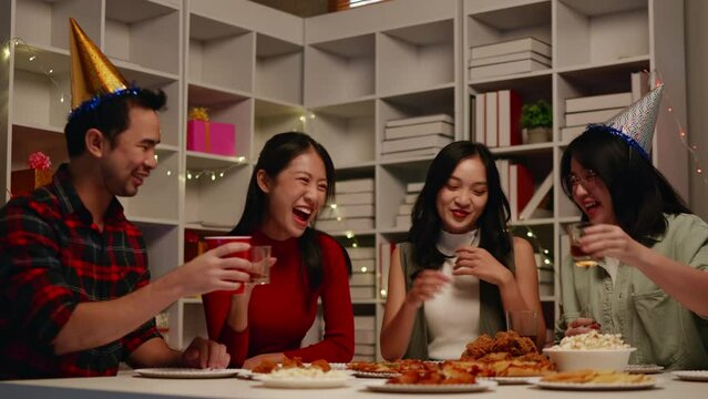 Friends join and celebrate the party with get cheers give a toast by clink glasses eating foods and drinks. Happy and joyful in holiday weekend and festival.