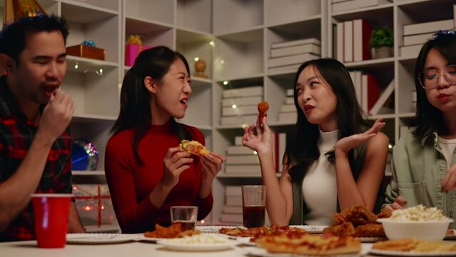 Friends join and celebrate the party with eating foods and drinks. Happy and joyful in holiday weekend and festival.