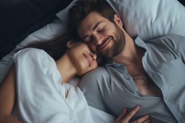 Fototapeta na wymiar beautiful brunette girl and guy lying on bed
