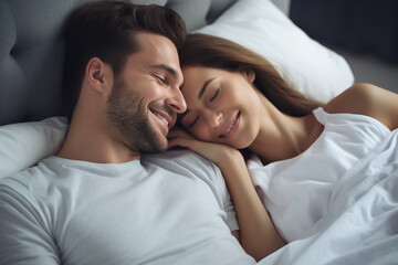 Fototapeta na wymiar beautiful brunette girl and guy lying on bed