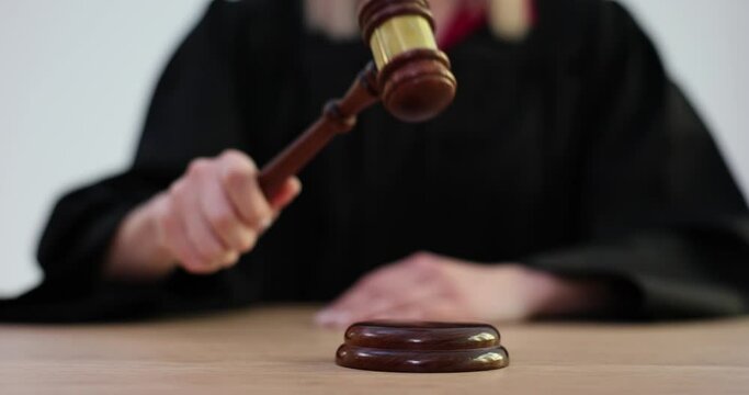 Judge knocking with wooden gavel in courtroom 4k movie slow motion