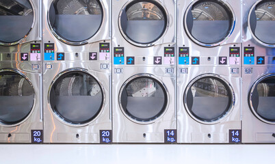 Rows of vending washing machines and clothes dryer are opening to service general customers in...