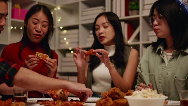 Friends join and celebrate the party with eating foods and drinks. Happy and joyful in holiday weekend and festival.