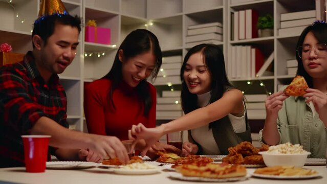 Friends join and celebrate the party with eating foods and drinks. Happy and joyful in holiday weekend and festival.