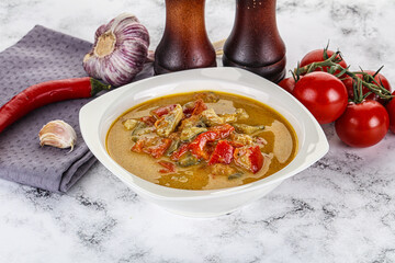 Traditional yellow Thai curry with chicken