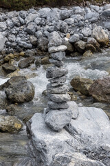 Naklejka na ściany i meble Stones balance in the river