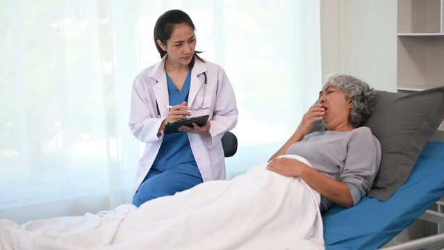Senior woman being examined by a doctor in clinic. background