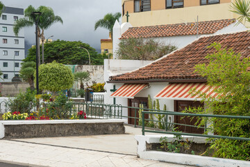 Fototapeta na wymiar Detail of a house with a wall cross in Puerto de la Cruz, Tenerife, Spain