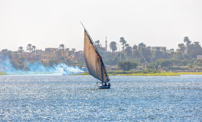 Tourists in a Felucca boat on the Nile River in Luxor Thebes - Egypt