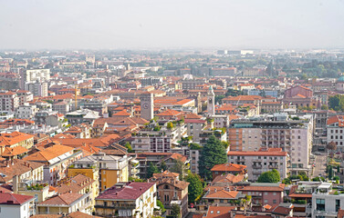 Fototapeta premium Bergamo, Italy. September 2023. View of the old city from the hill. Landscape in the city center, its historical buildings, churches and towers.